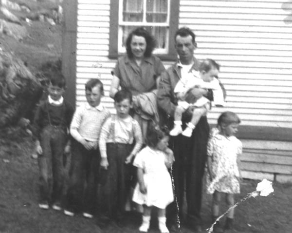 247: John Mulrooney and his wife Bernadette Williams, with their children, l-r Pat, Dan, Berk,  Loretta, Marg and baby Mary Jane (held by her father), at Red Island. (circa 1957) [courtesy of  Berkley Mulrooney]  - John son of Patrick Mulrooney &amp;amp; Mary Jane Northover